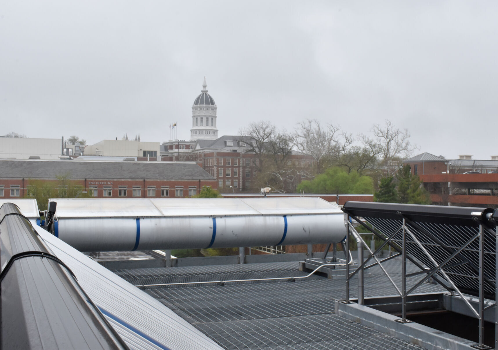 Jesse Hall can be seen through the foggy haze